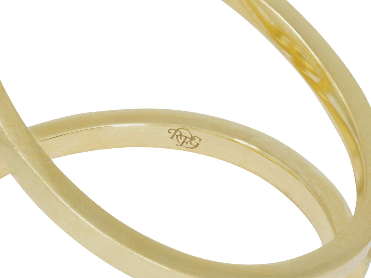 Close-up of a yellow gold ring band with RFG signature