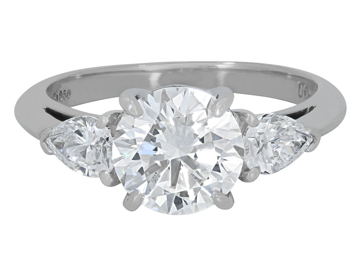 Platinum diamond ring with pear shaped side stones