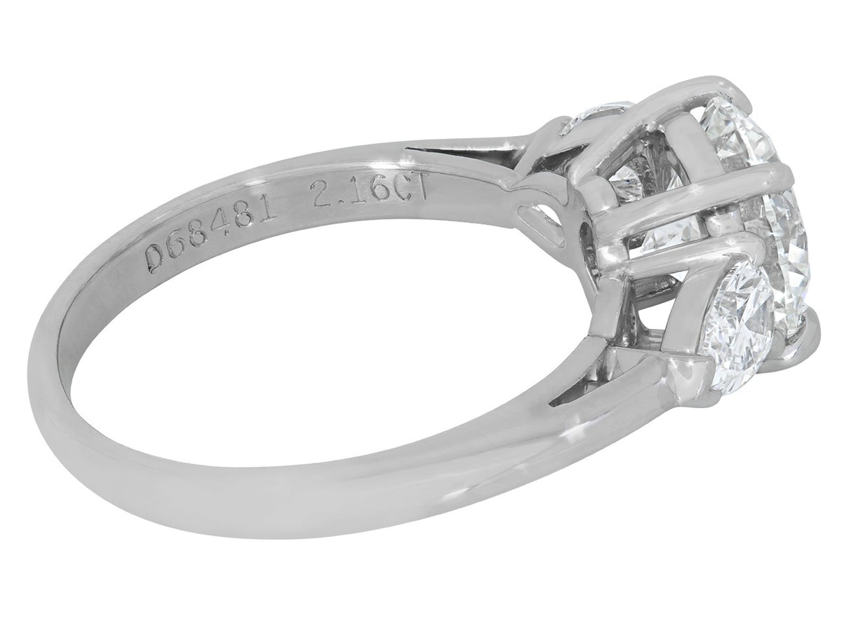 Platinum diamond ring with pear shaped side diamonds