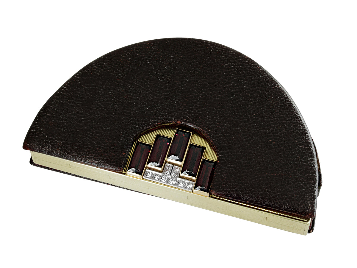 Closed half moon box with black leather and gold trim