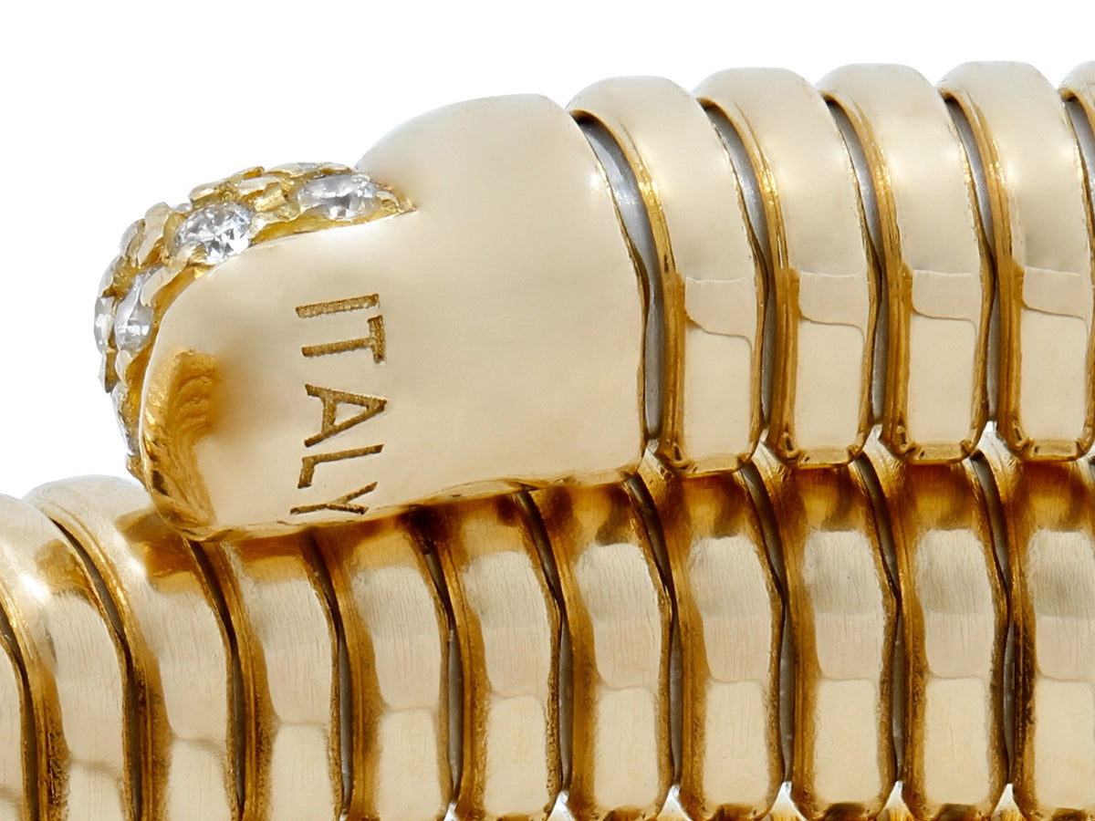 Close up of a five row 18K gold tubogas bracelet with diamond terminal