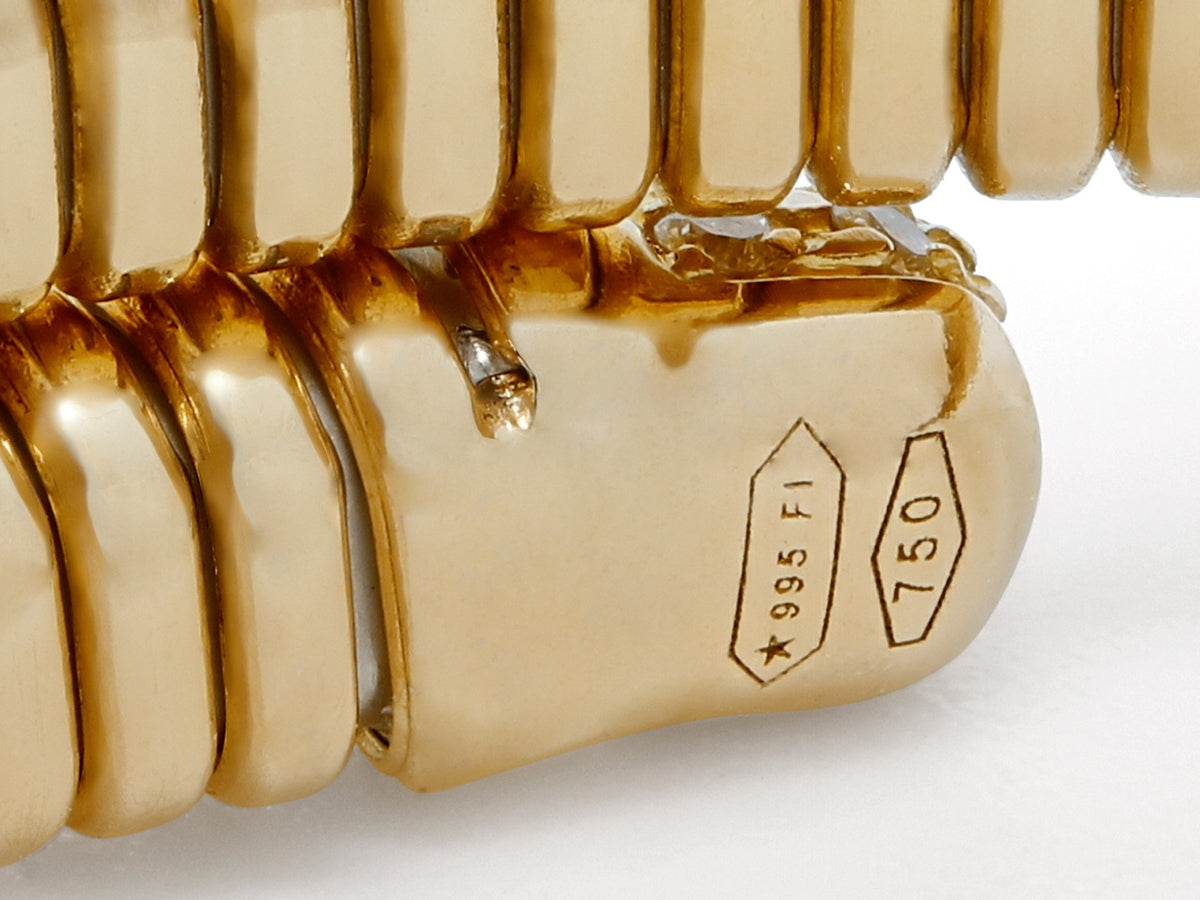 Close up of 18K gold bracelet clasp with hallmarks