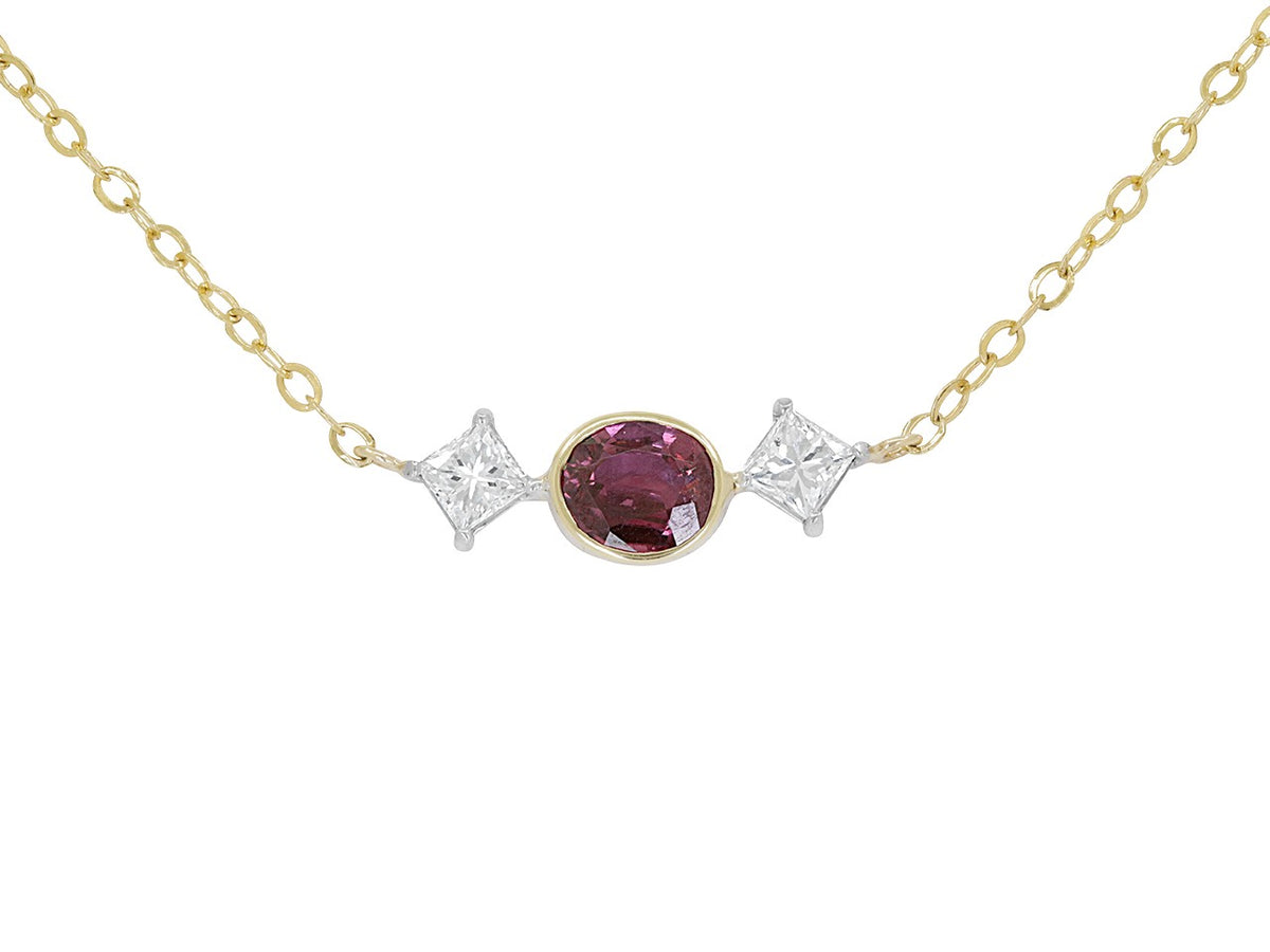 Gold chain necklace with oval ruby and two diamonds