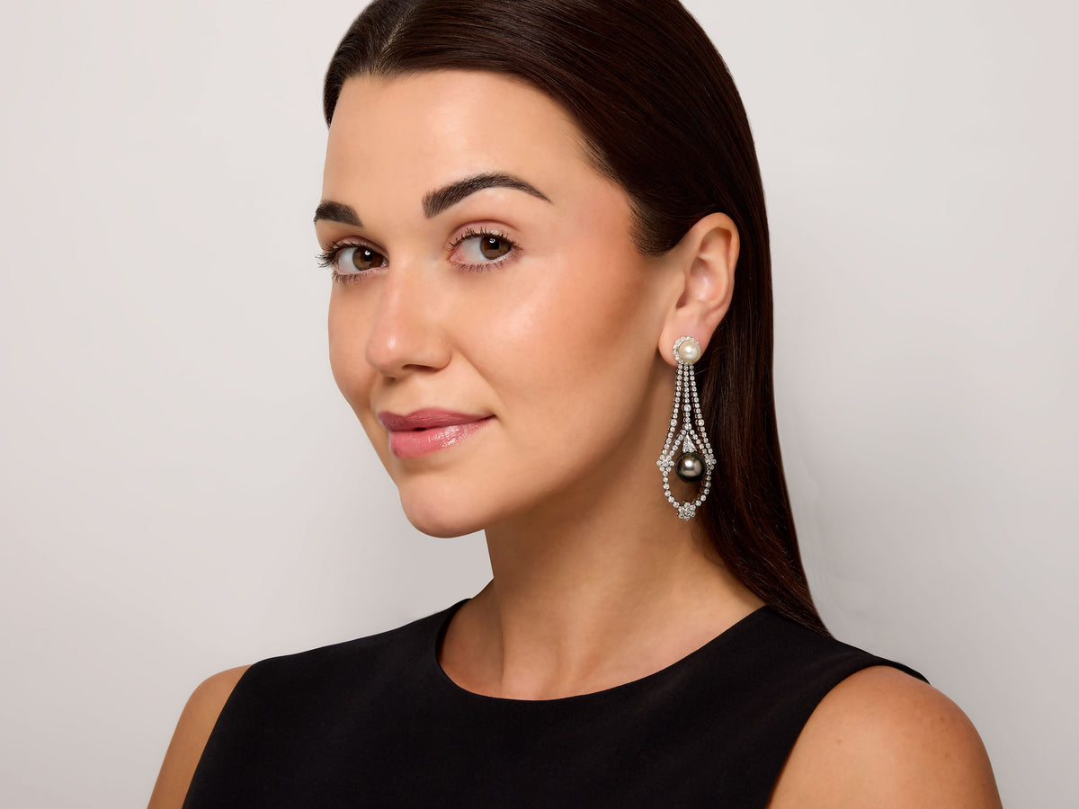 Woman wearing a diamond and pearl drop earring