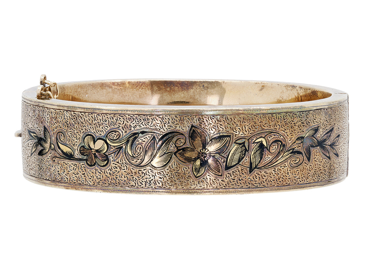 Antique 12K gold bangle with black enamel floral design