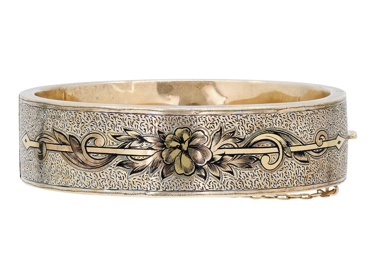 Antique Victorian 12K gold bangle with black enamel floral motif