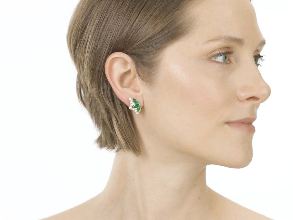 Woman wearing a fan shaped jade and diamond earring in 18K gold