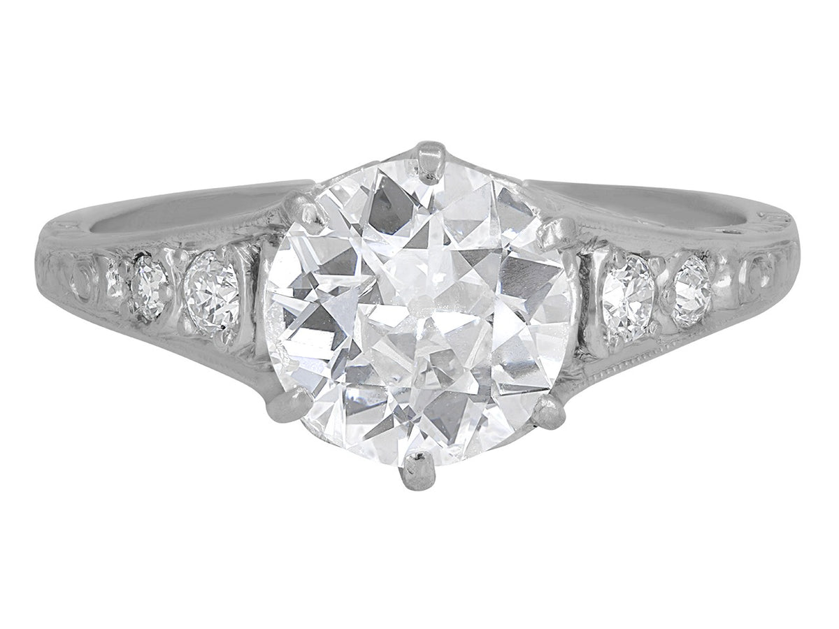 Art Deco platinum solitaire ring with diamond shoulders