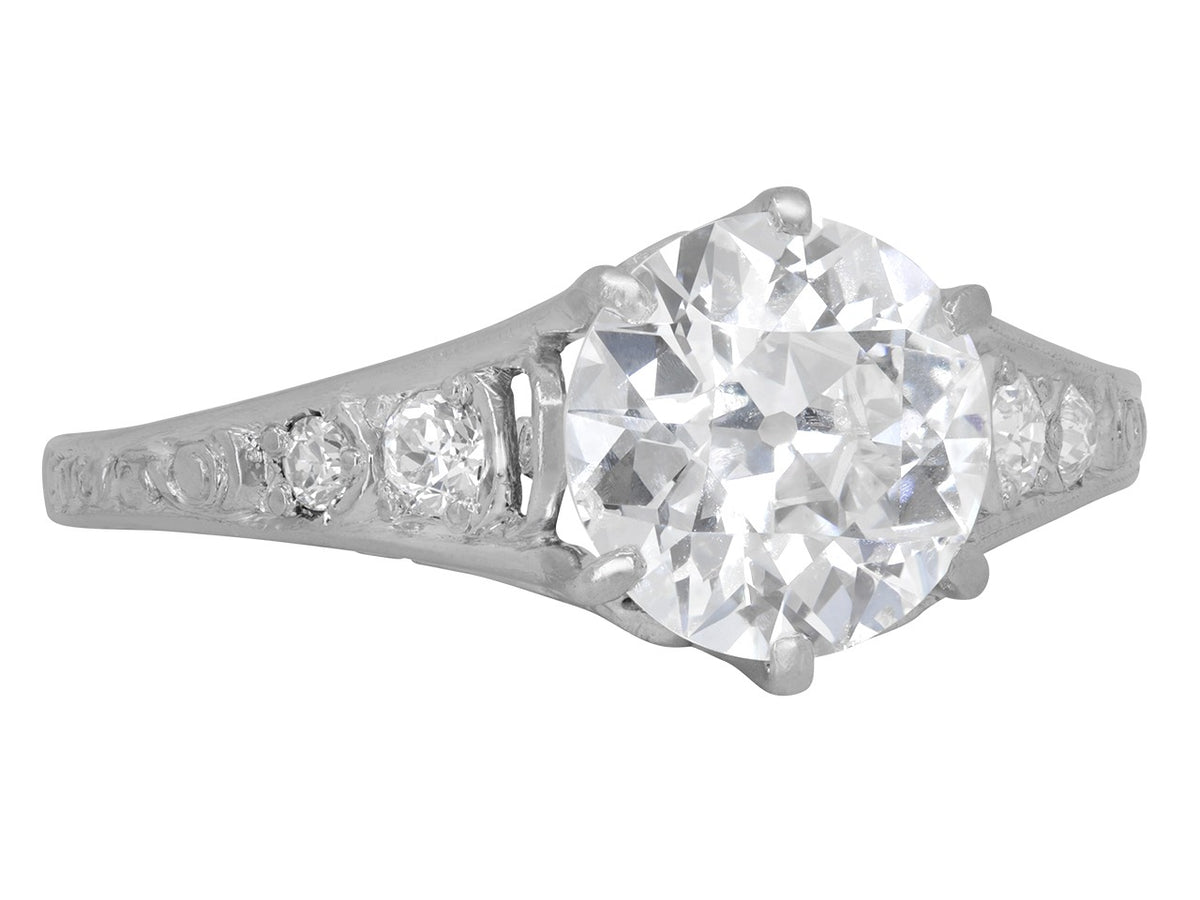 Art Deco platinum solitaire ring with diamond shoulders
