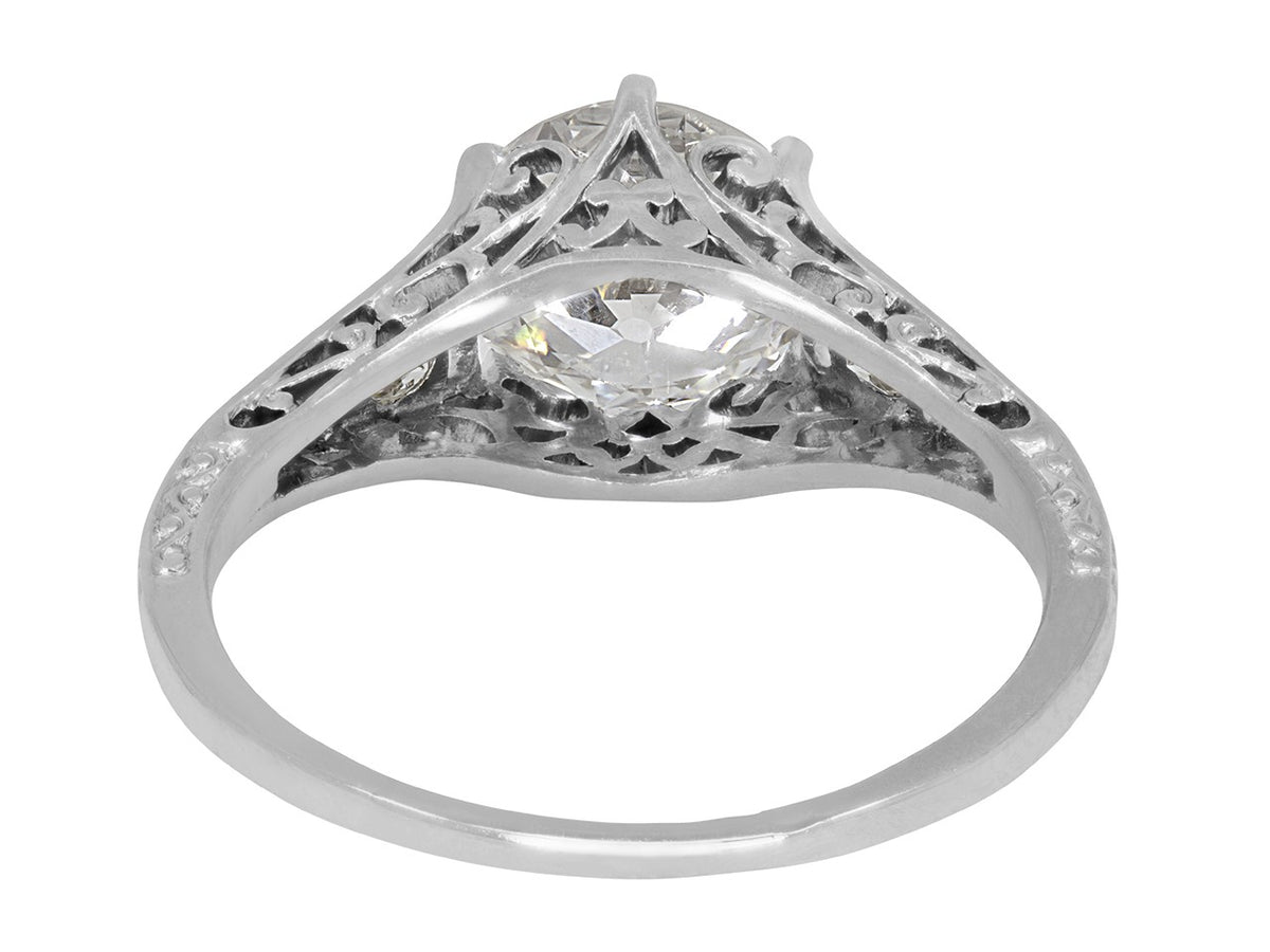 Platinum diamond solitaire ring with pierced scroll gallery