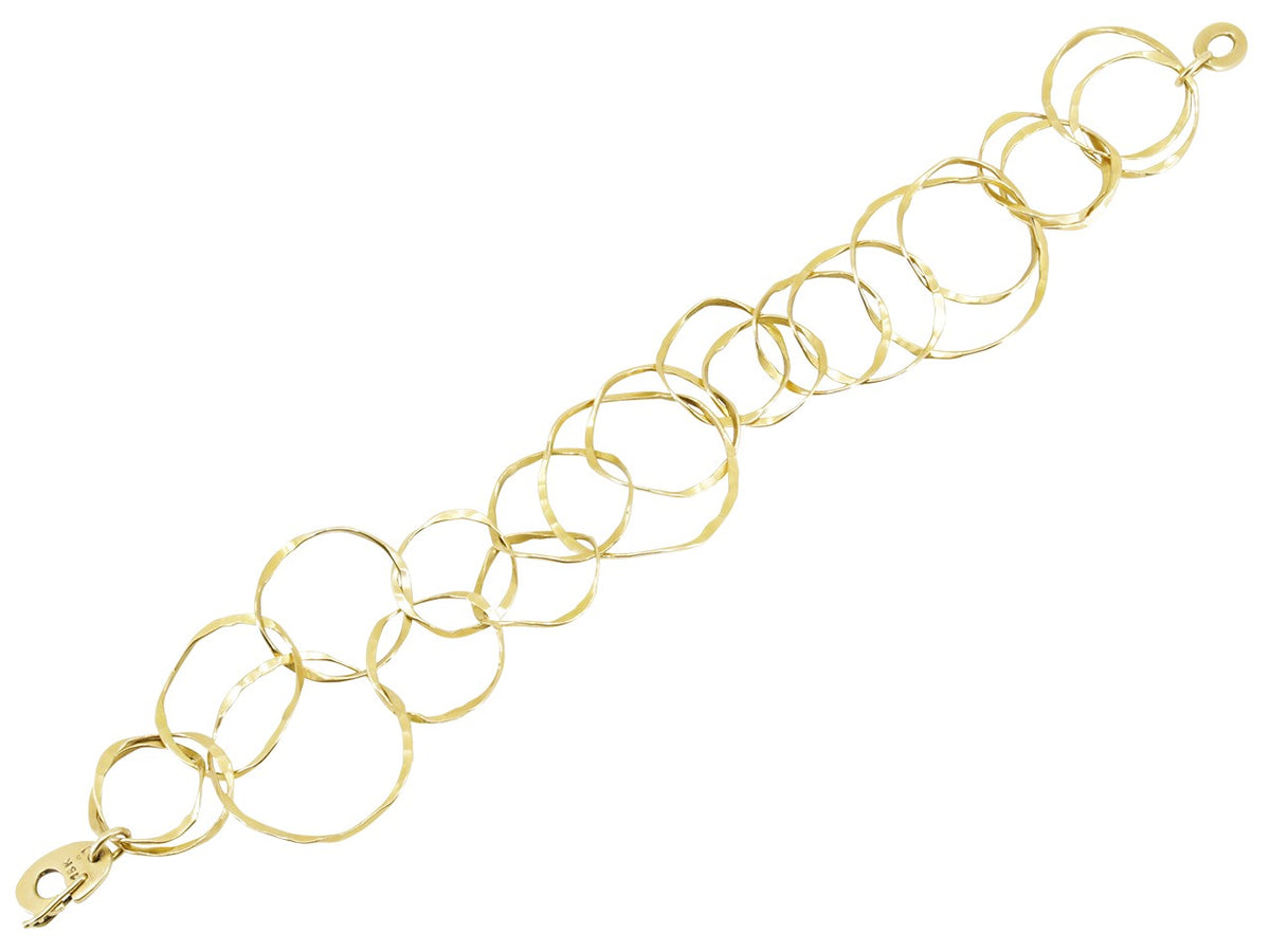 Hand hammered 18K yellow gold bracelet with varied spherical links