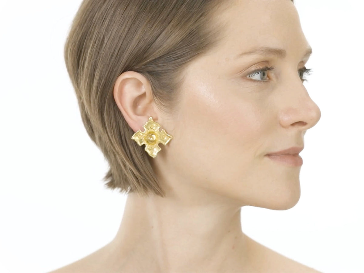 Woman wearing a hand hammered 22K gold ear clip