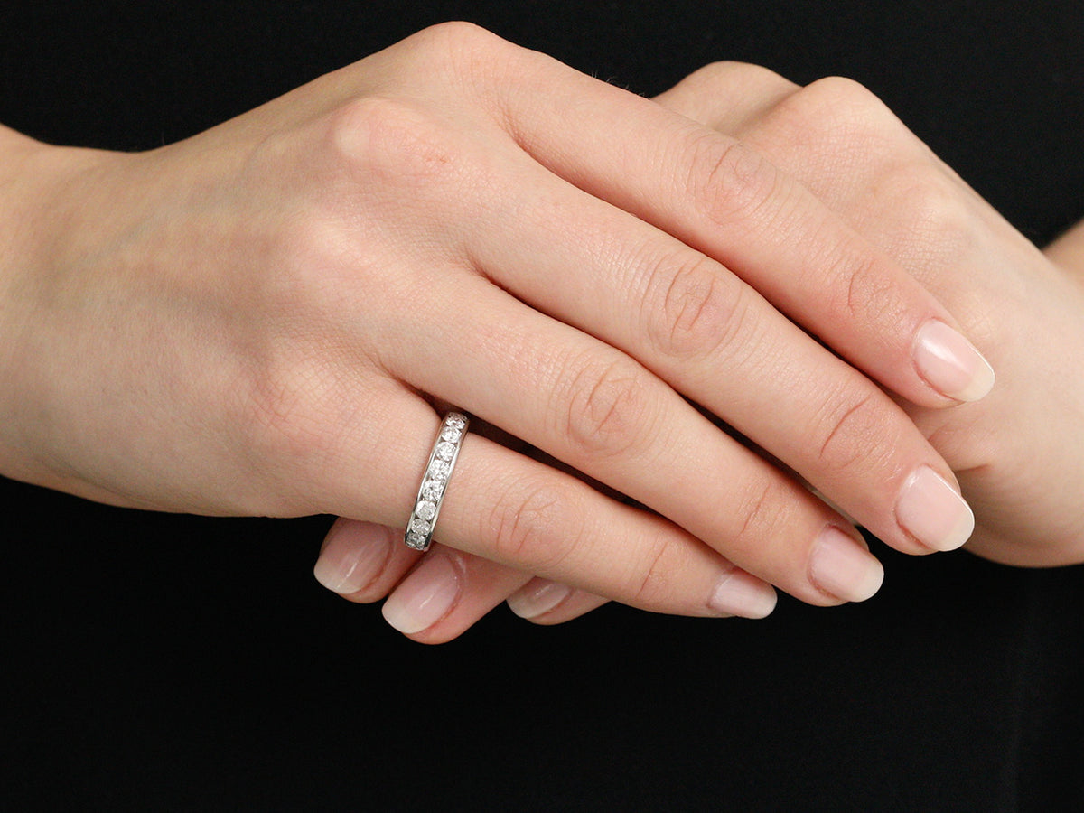 Diamond eternity band worn on a hand