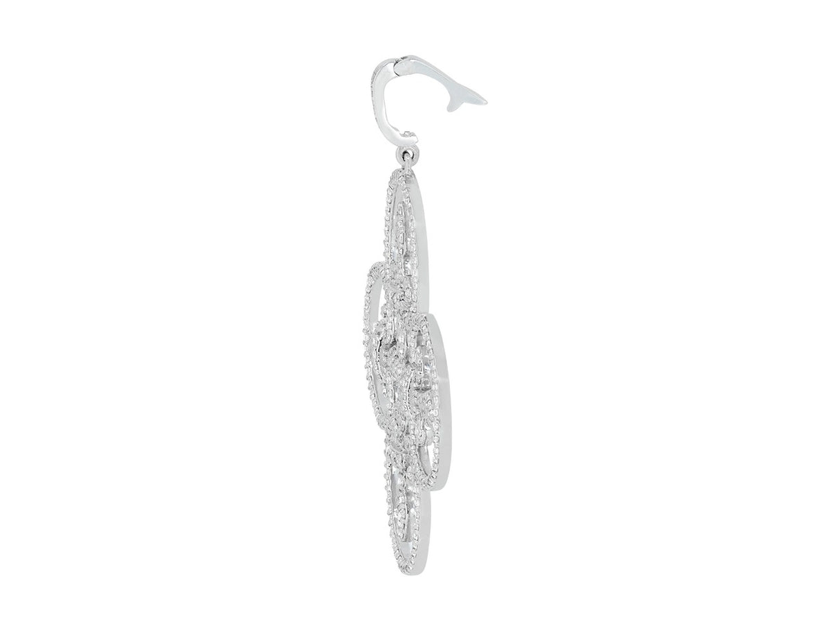 Side view of a diamond set white gold pendant