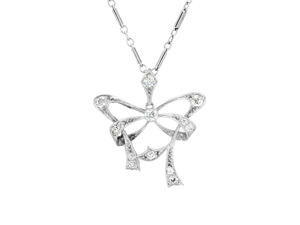 Diamond bow pendant on a platinum chain
