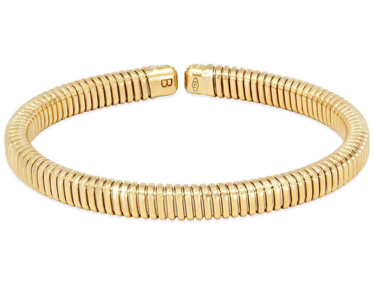 18K gold tubogas bracelet with diamond set terminals