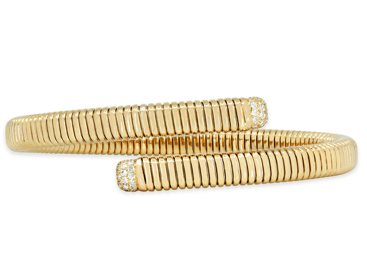 18K gold tubogas bypass bracelet with diamond terminals