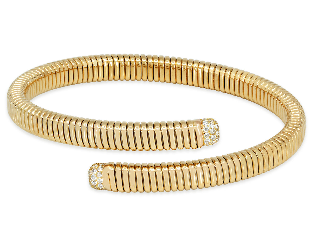 18K gold tubogas bypass bracelet with diamond terminals