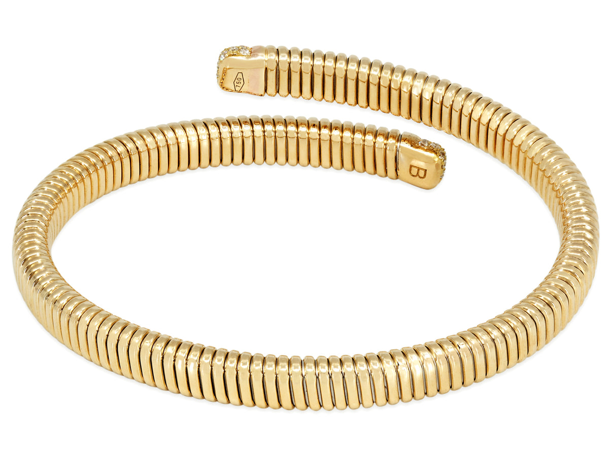 18K gold tubogas bypass bracelet with diamond terminals