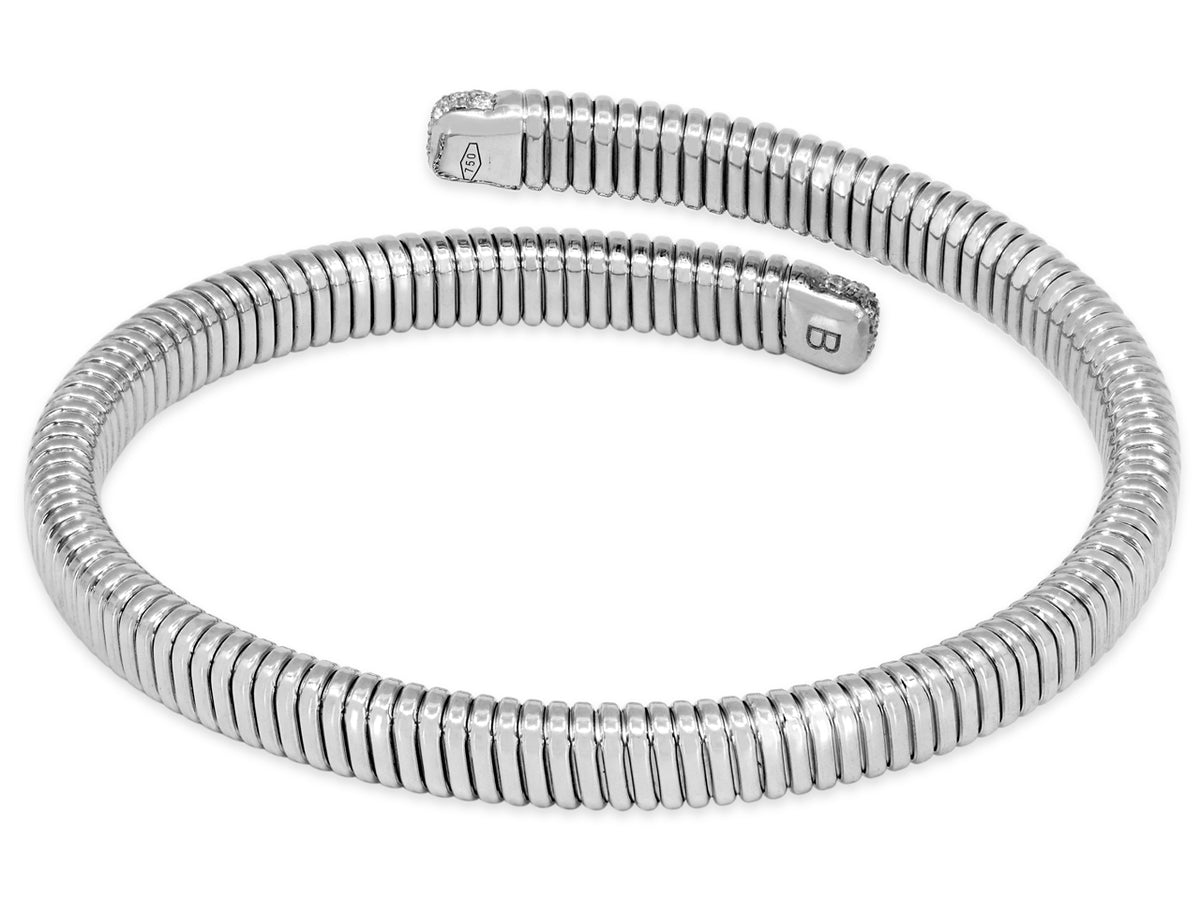 Tubogas bypass bracelet in 18K white gold with diamond terminals
