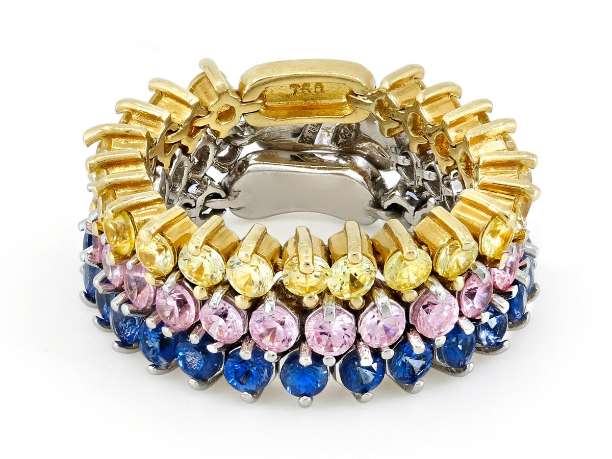 Three flexible 18K gold sapphire bands in yellow pink and blue
