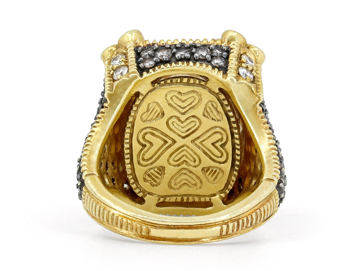 Back of an 18K gold ring with ornate heart engravings