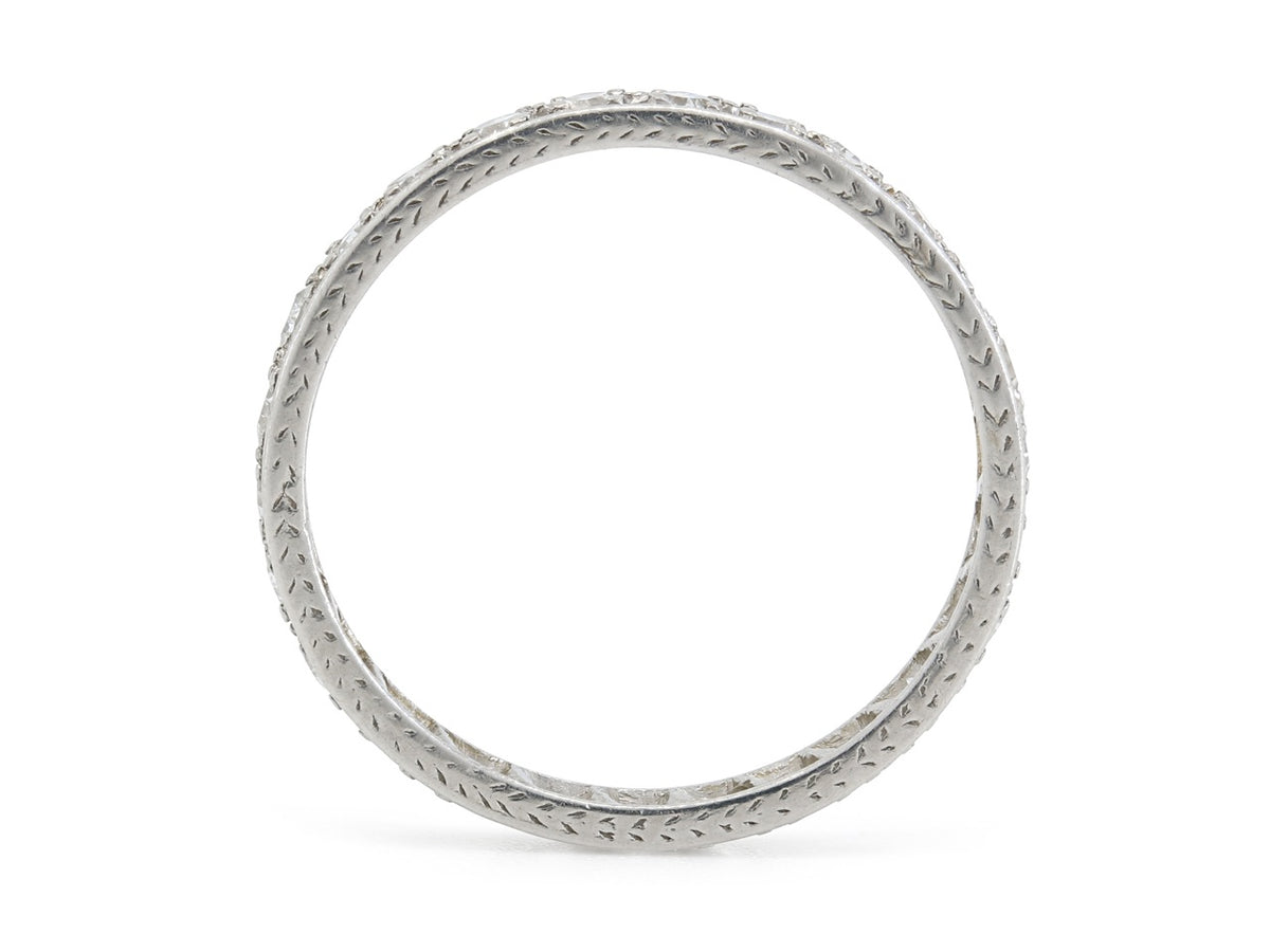 Platinum diamond eternity band with engraved borders