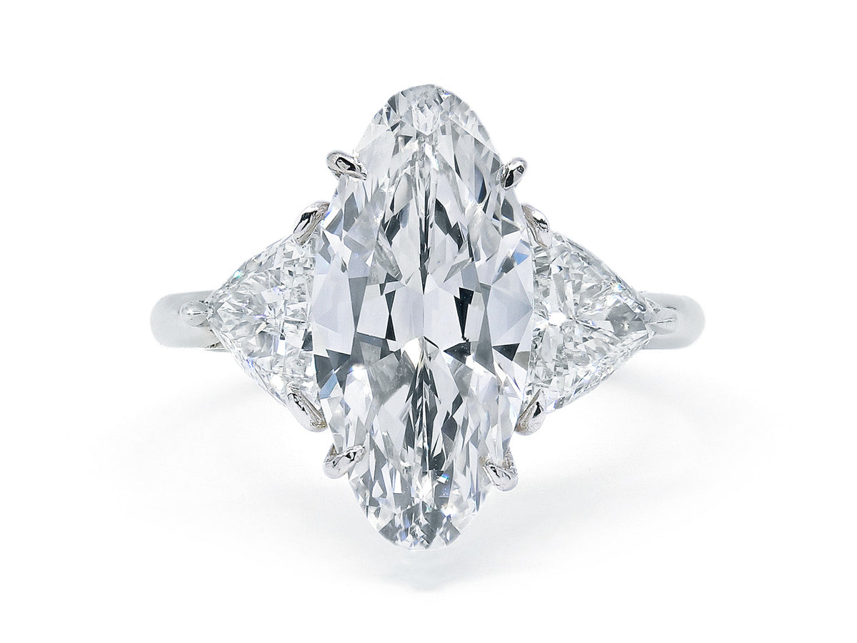 Marquise cut diamond ring with trillion diamond shoulders