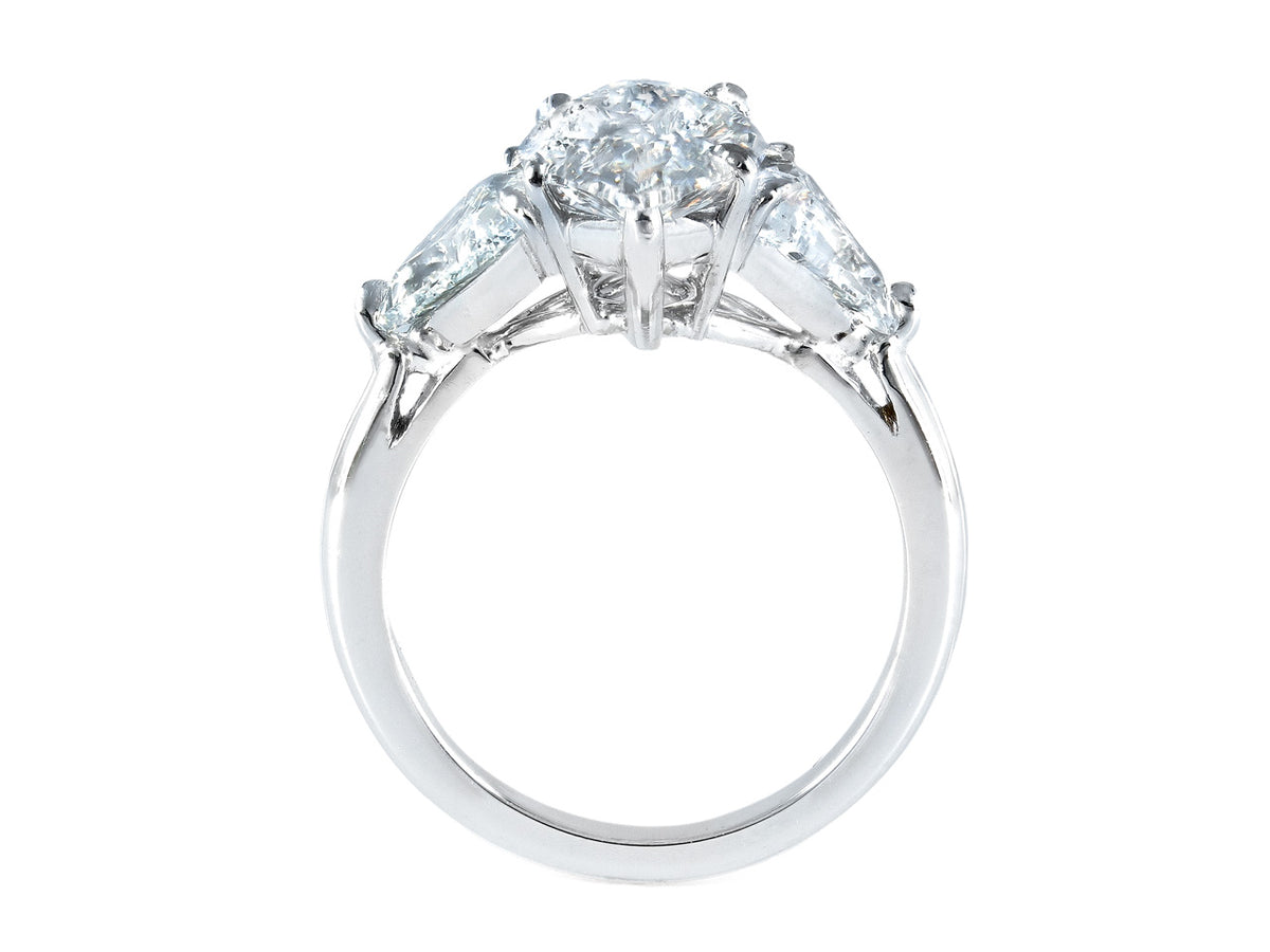 Side view of platinum marquise diamond ring with side stones