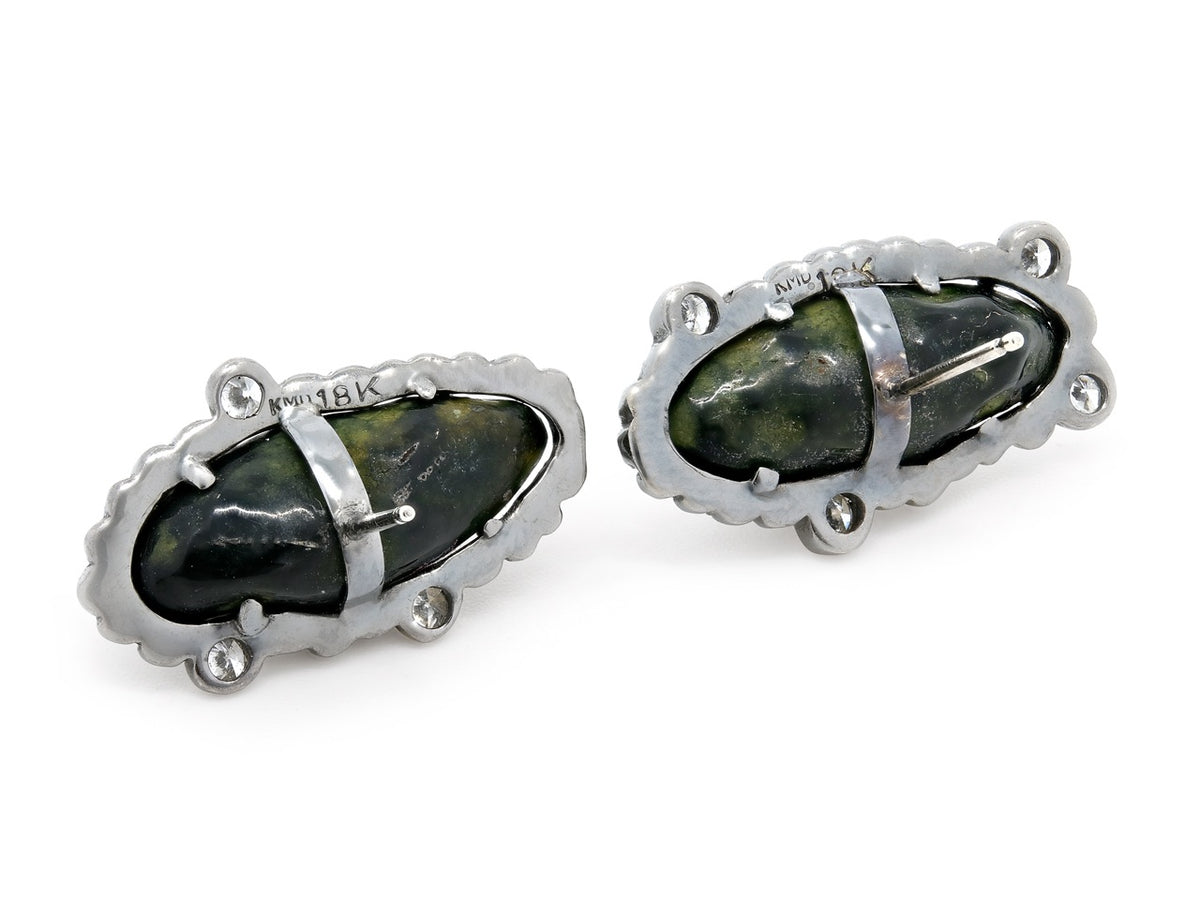 Black geode stud earrings bordered by diamonds