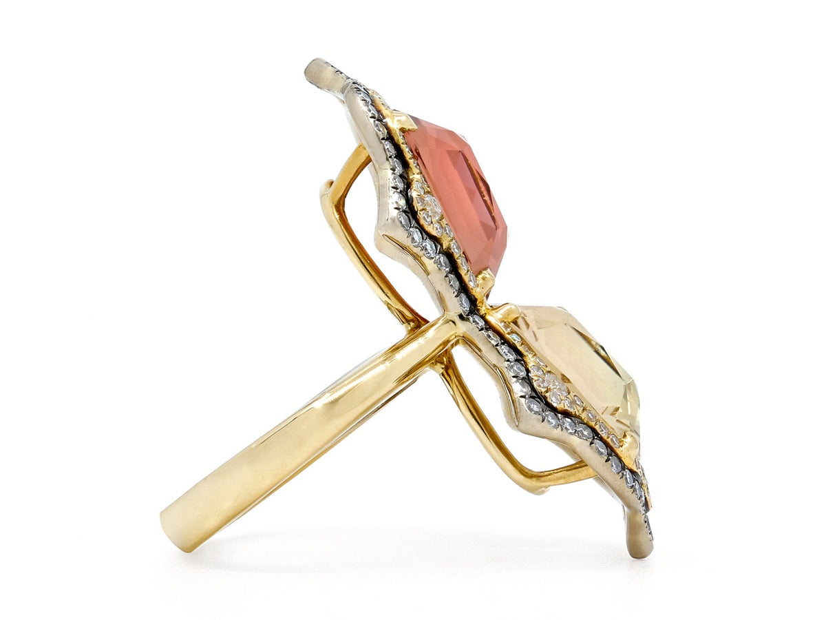 Side view of an 18K gold ring with two tourmalines