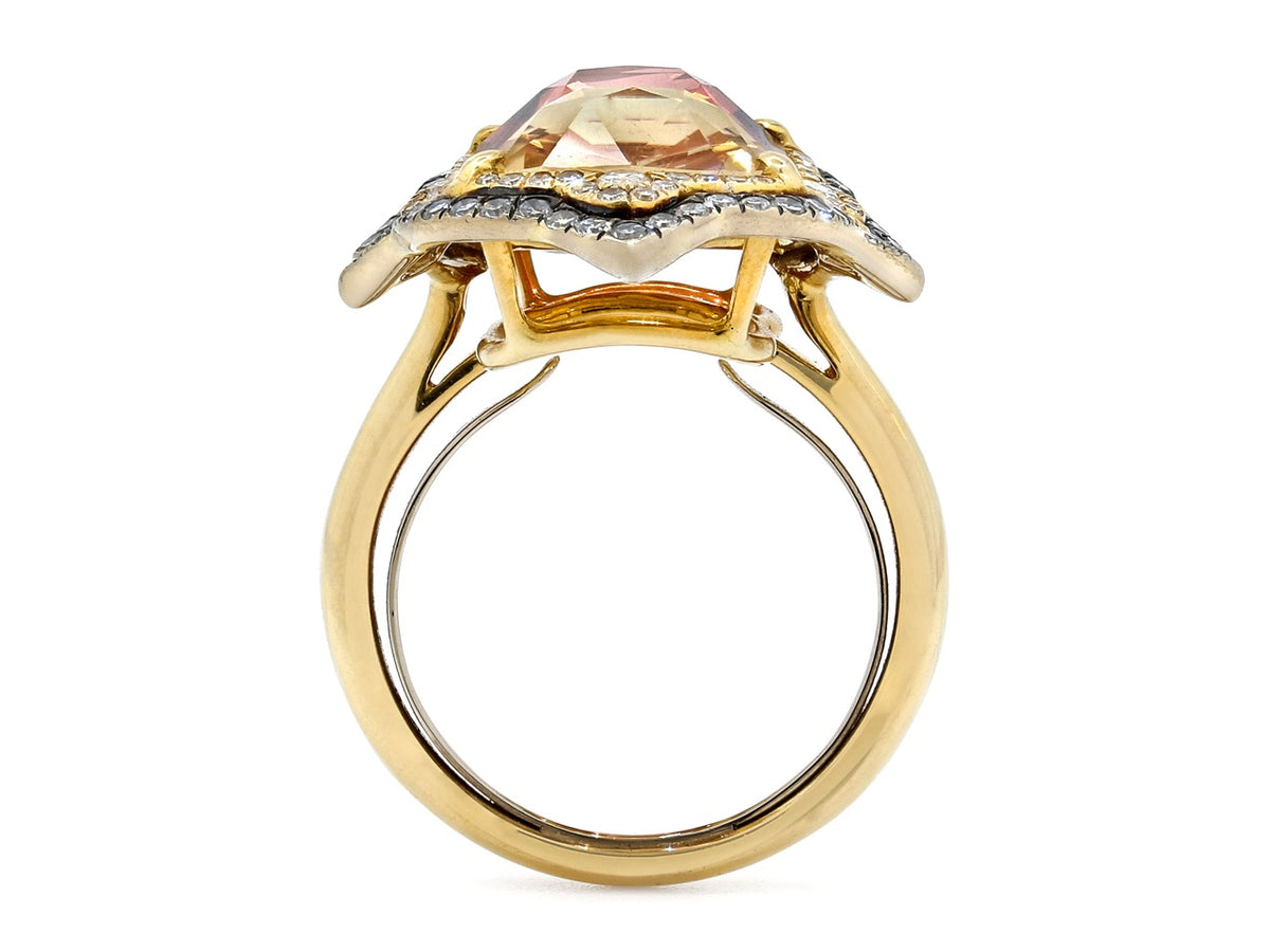 Side view of a yellow gold ring with tourmaline and diamond setting