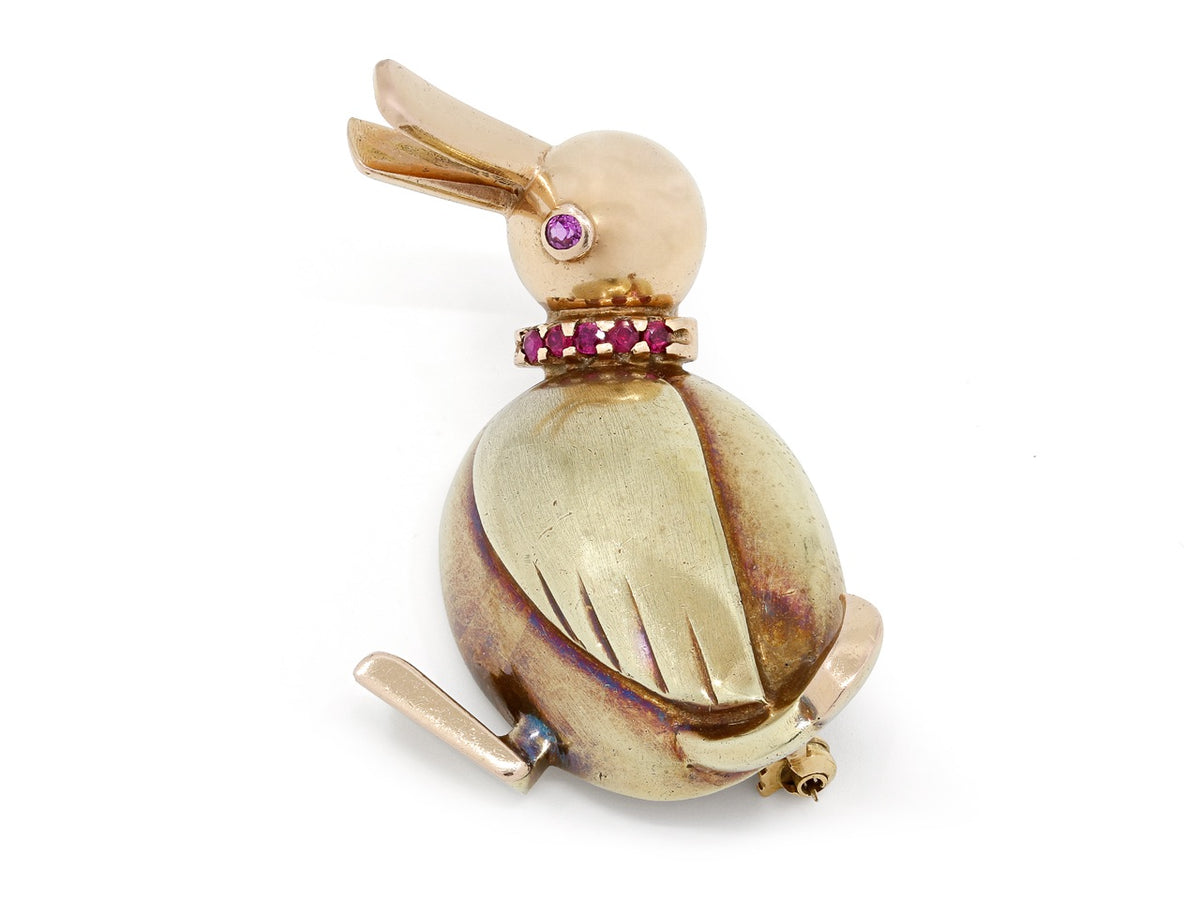 Gold duck brooch with ruby collar and eye