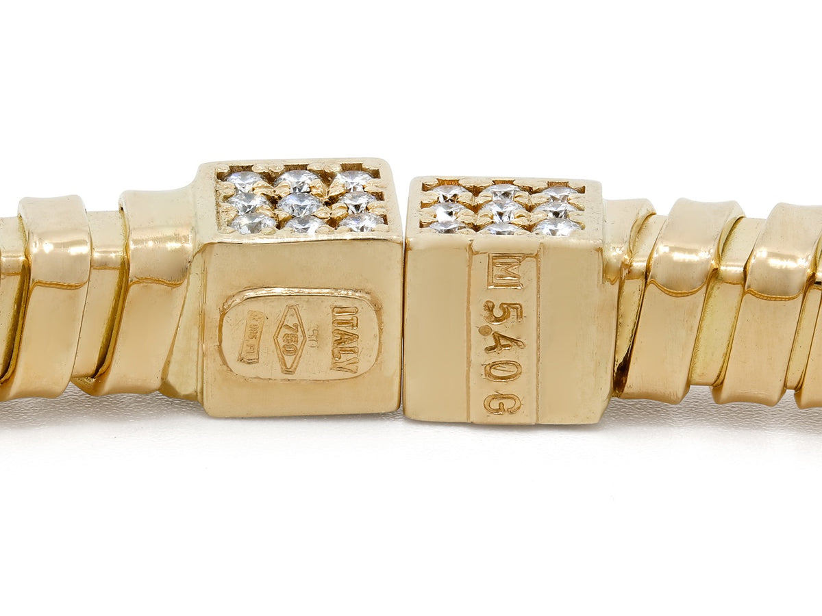 Close up of diamond set 18K gold bracelet clasp