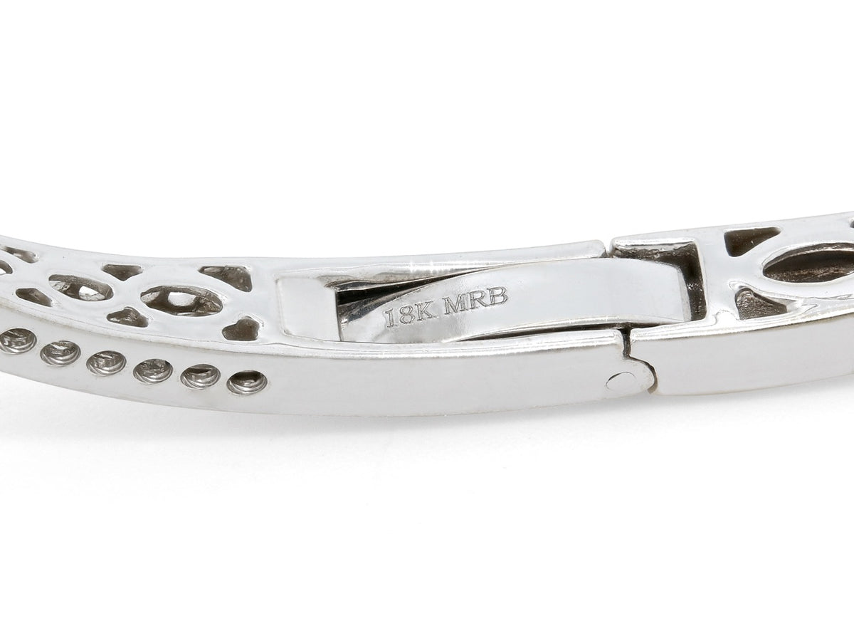 Close view of 18K white gold bangle clasp and diamond settings