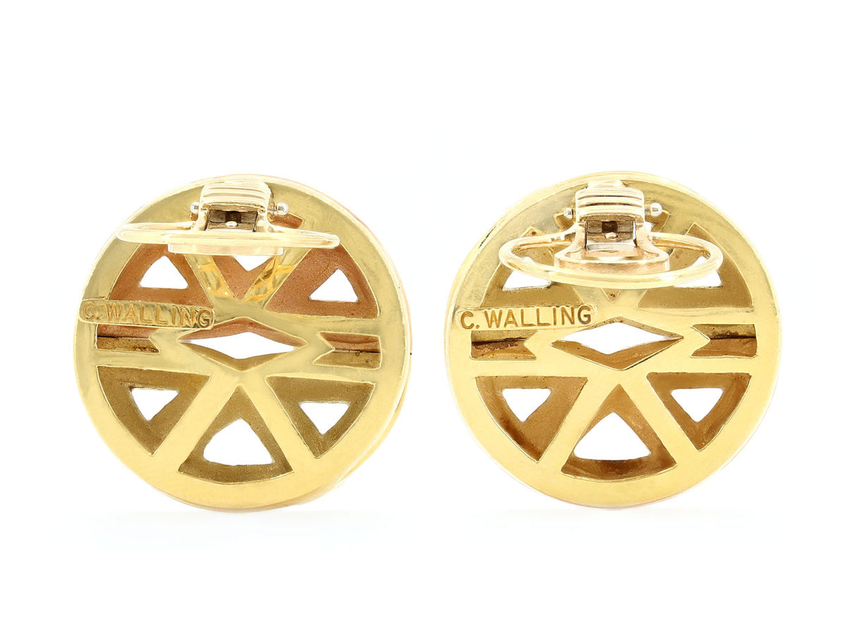 Back view of round geometric gold earrings with posts