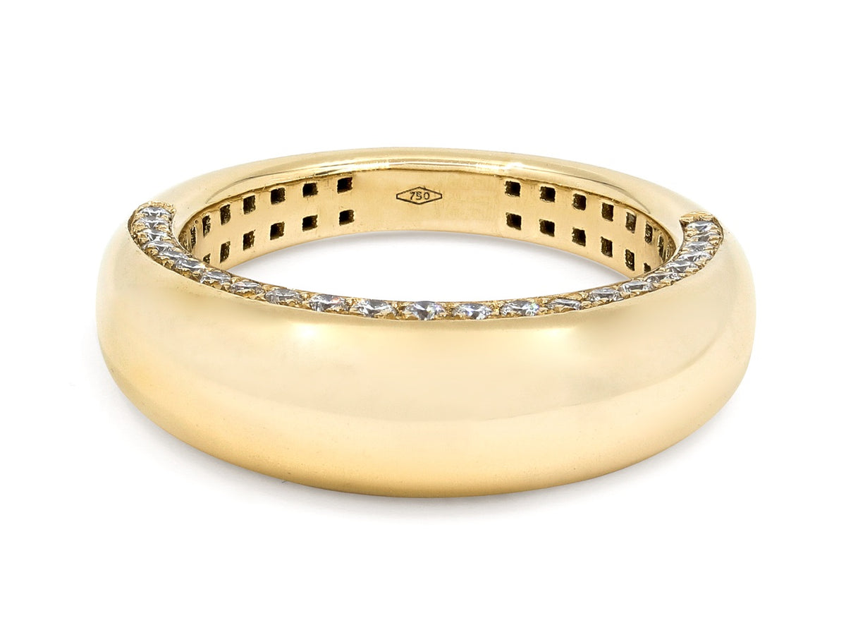Polished 18K gold bombe ring with diamond set edges