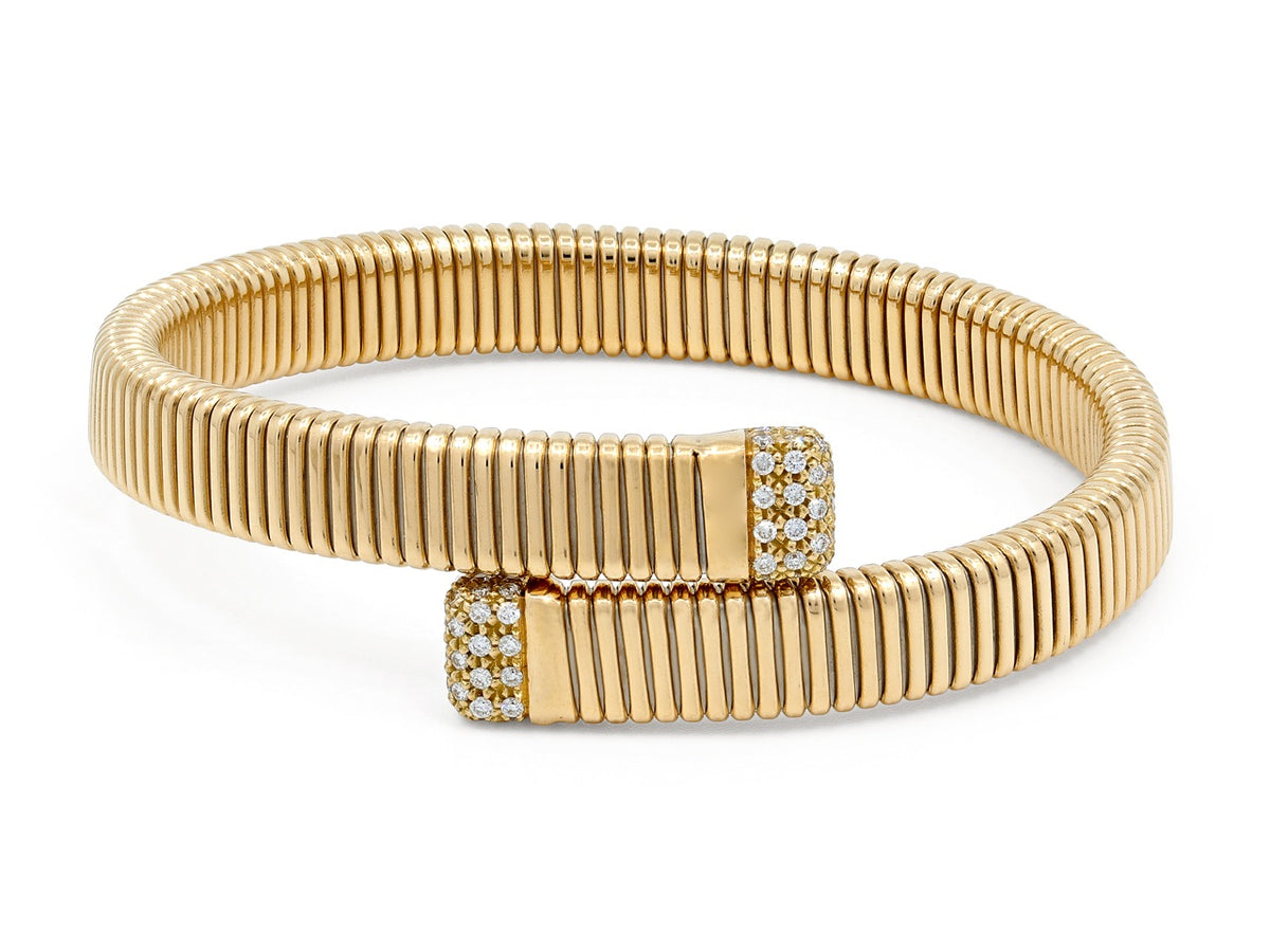 18K gold tubogas bypass bracelet with diamond terminals