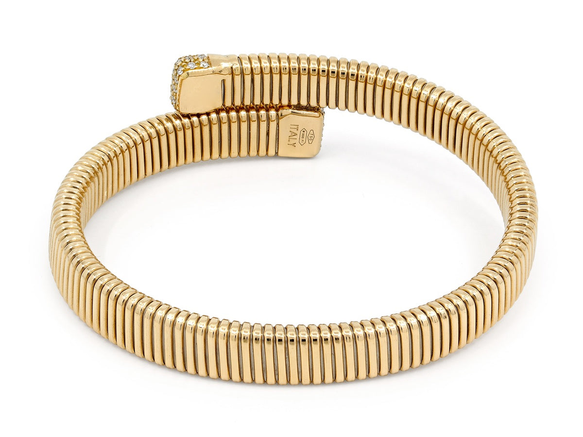 18K gold tubogas bypass bracelet with diamond terminals