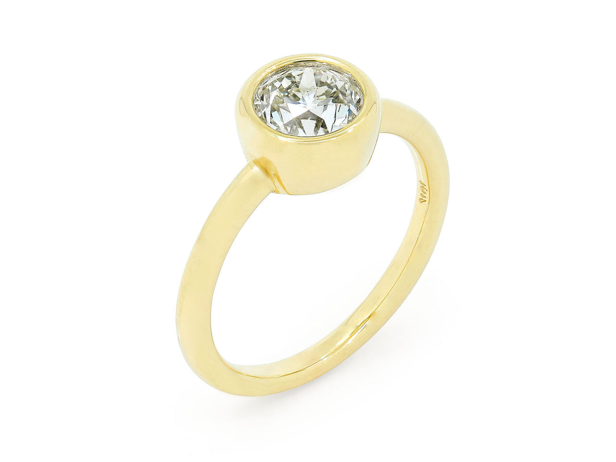 Bezel set diamond ring in 18K yellow gold