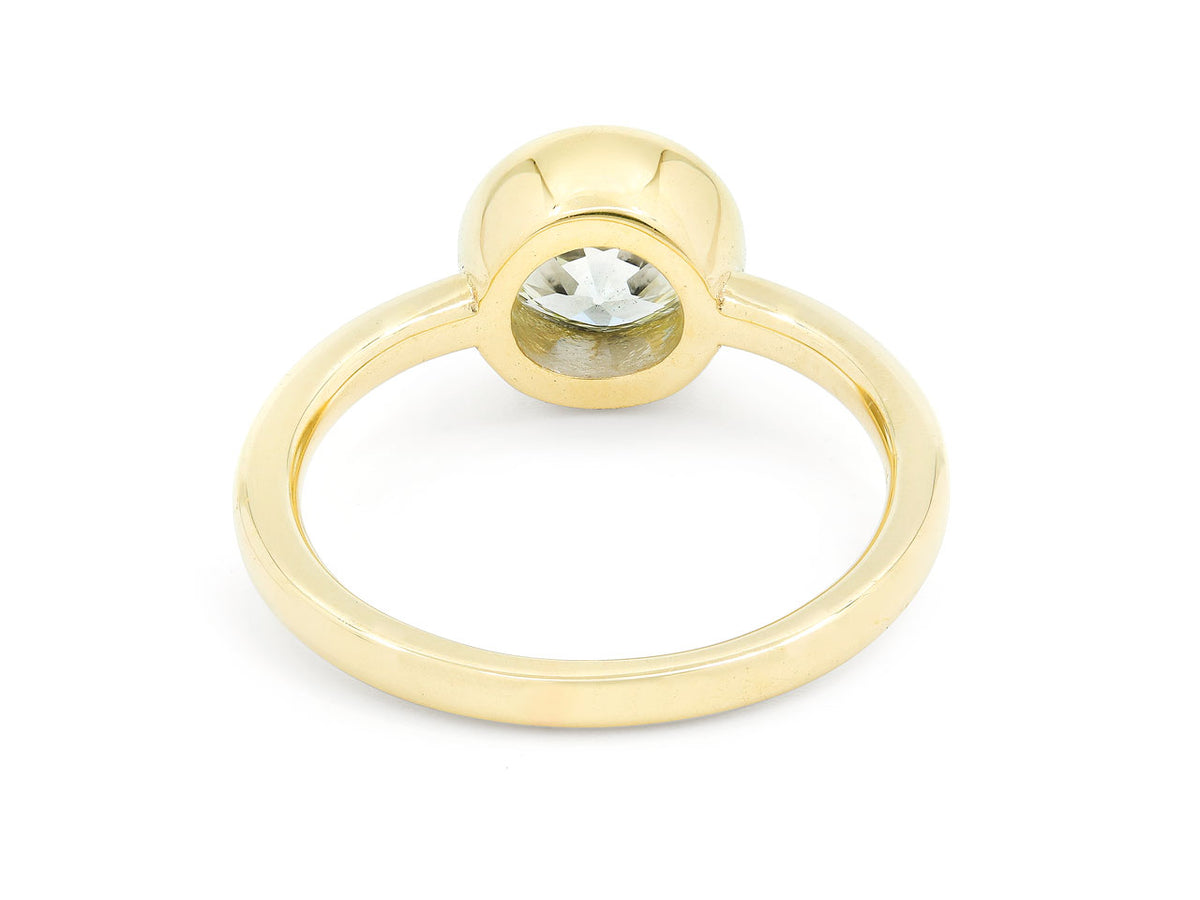 Underside view of an 18K gold bezel set diamond ring