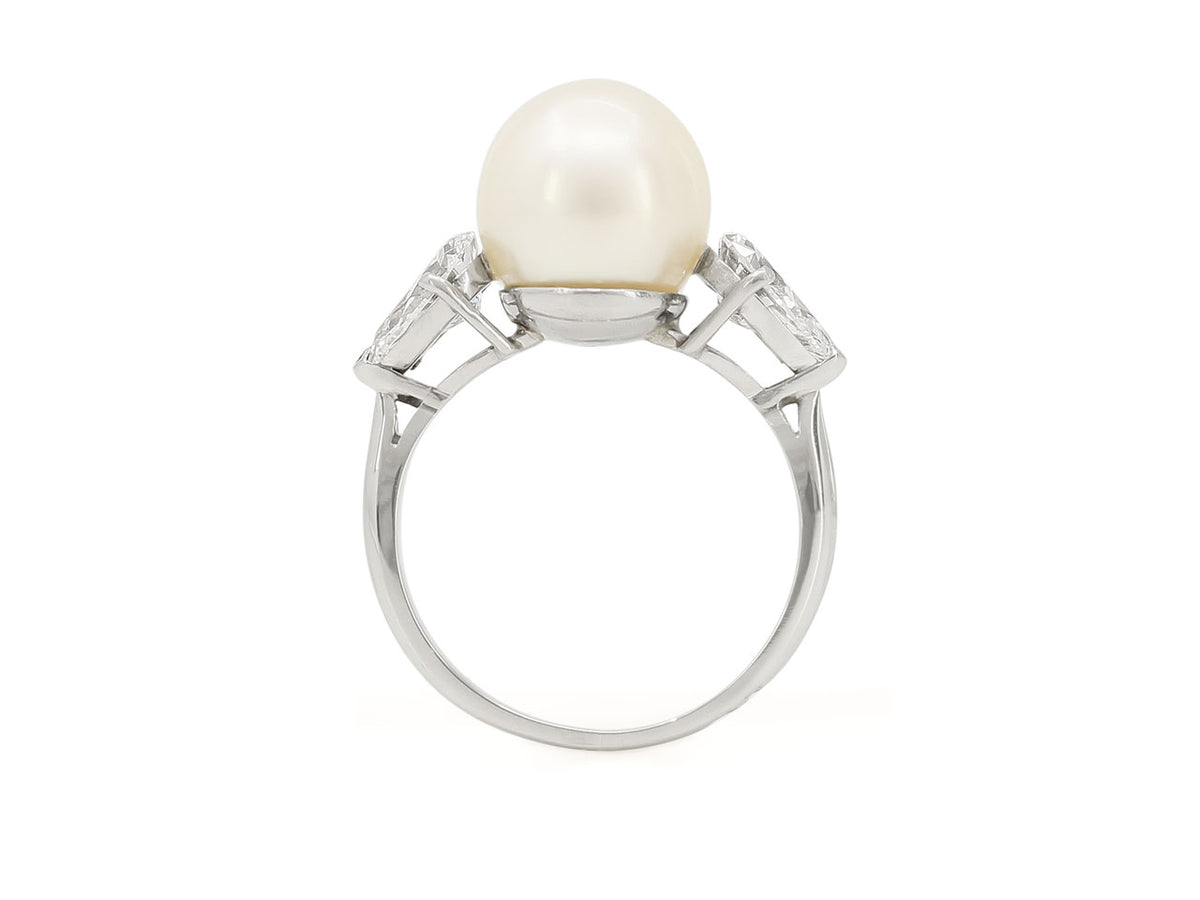 Side view of a platinum ring with pearl and diamonds