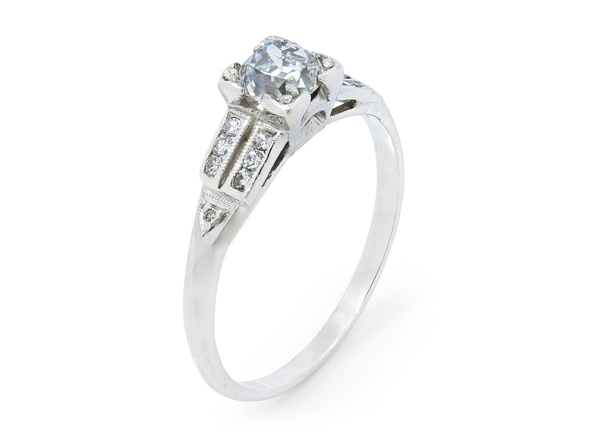 Art Deco platinum ring with old mine diamond and side accents