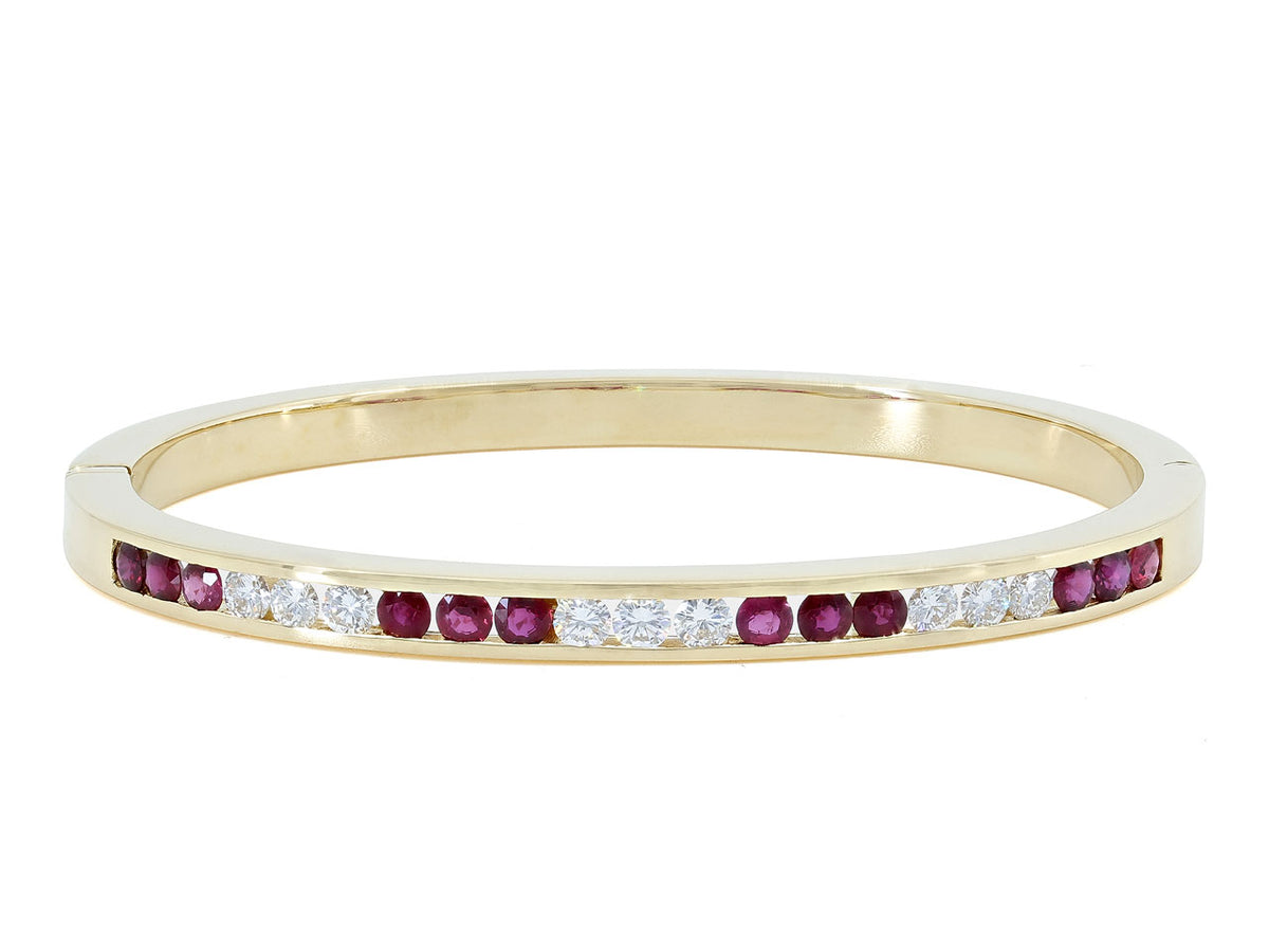 18K gold bangle with alternating ruby and diamond trios