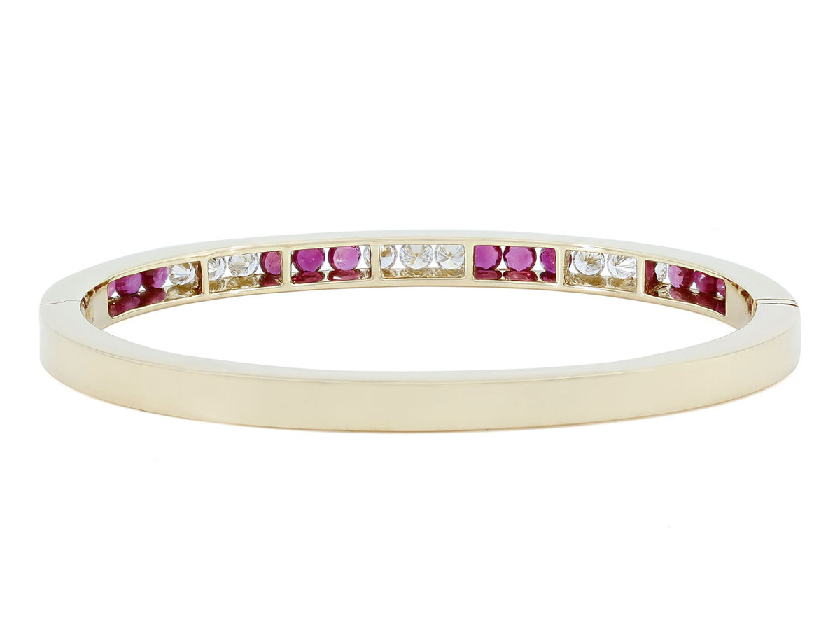18K gold bangle with alternating ruby and diamond channel setting