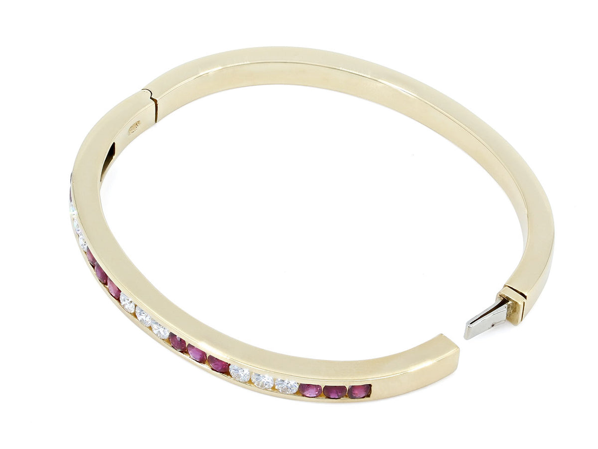 18K gold hinged bangle with alternating ruby and diamond trios