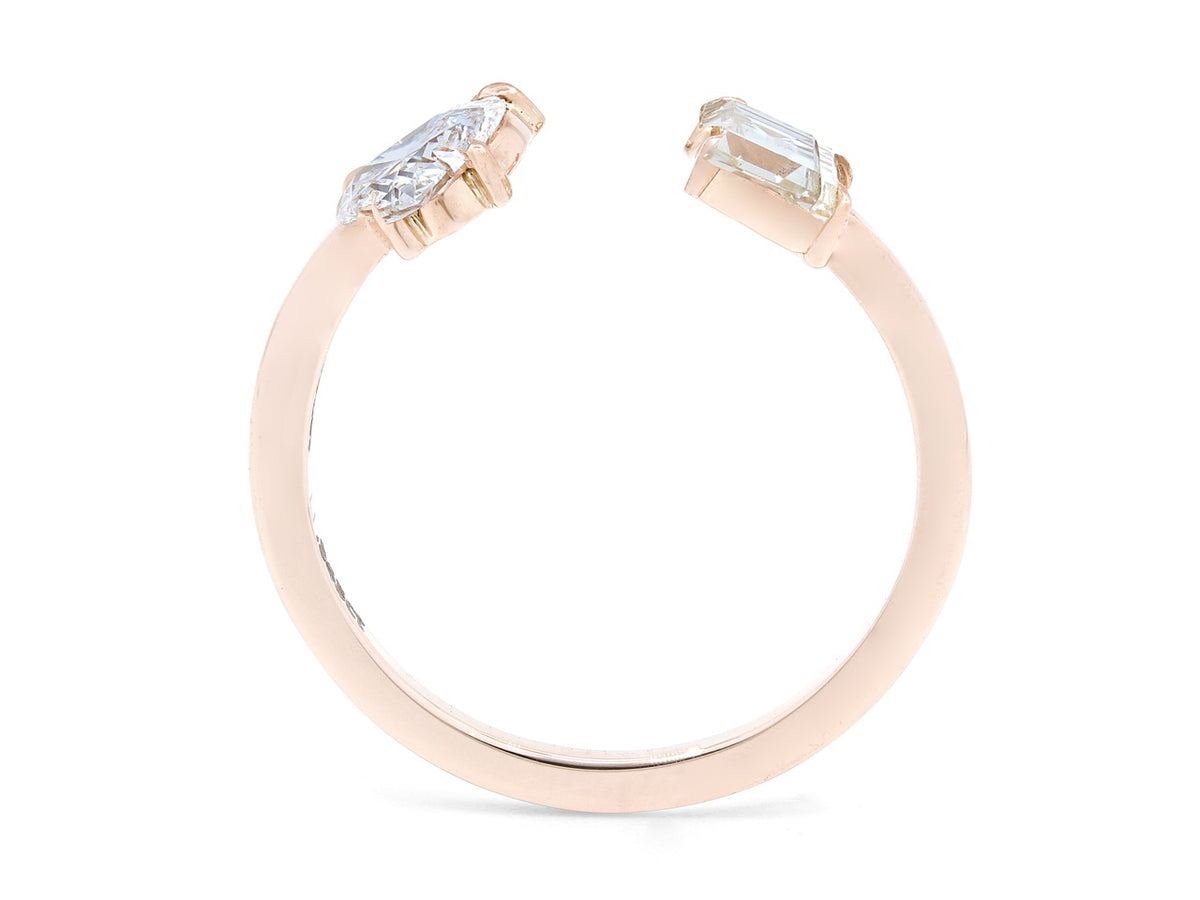 Open rose gold ring with heart and step cut diamond terminals