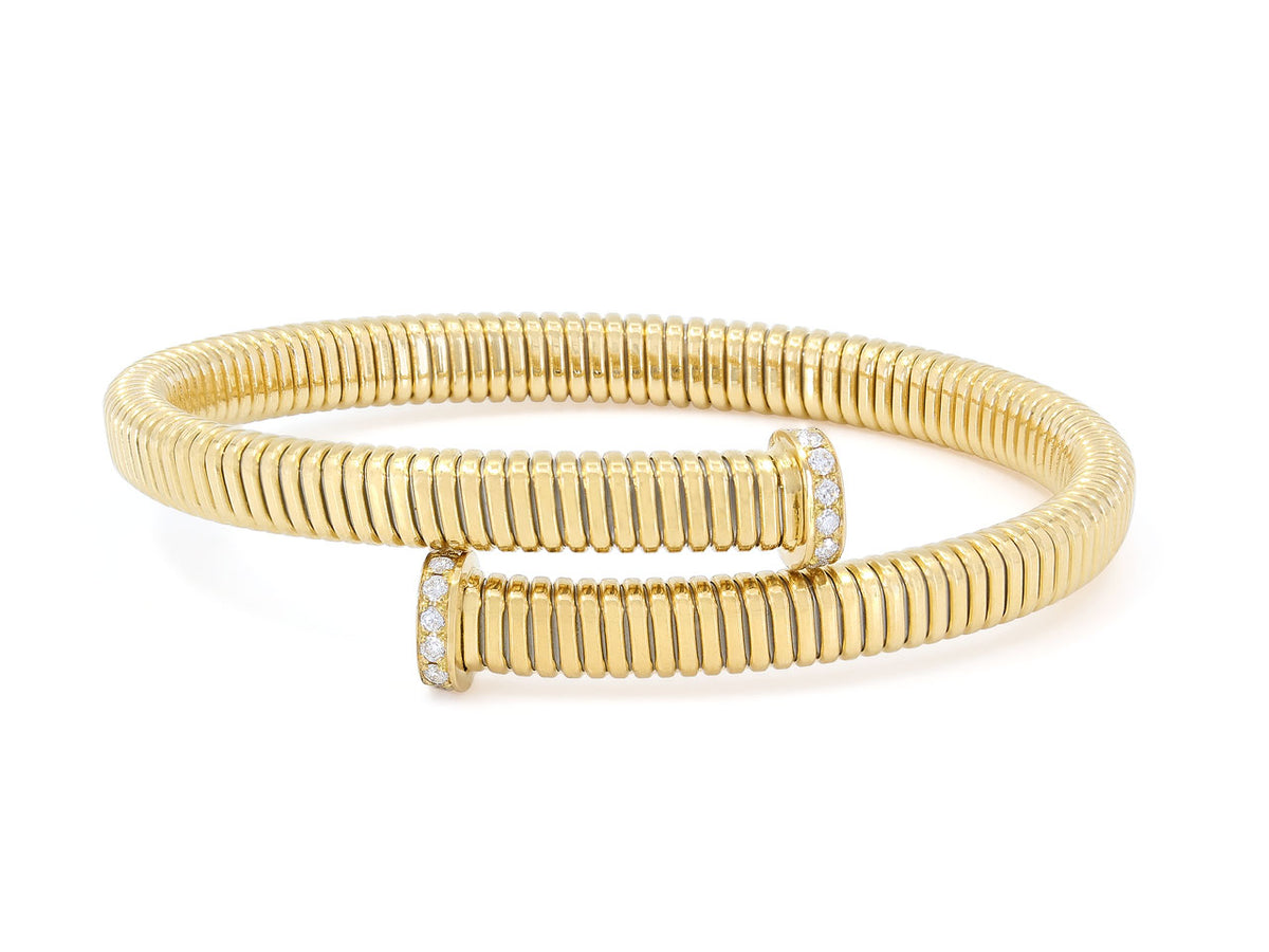 Yellow gold tubogas bypass bracelet with diamond set nail head terminals