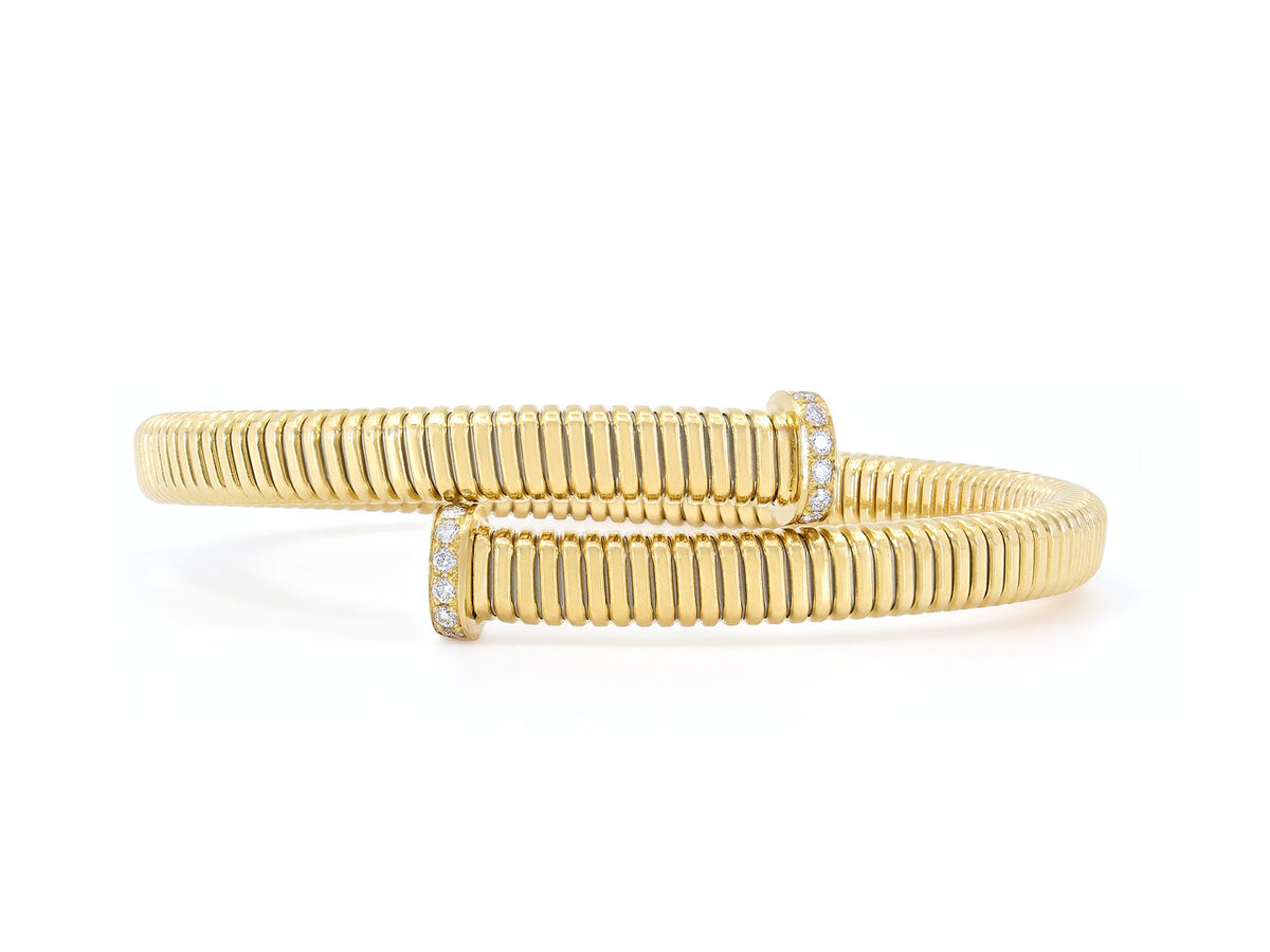 18K yellow gold tubogas bypass bracelet with diamond nail head terminals