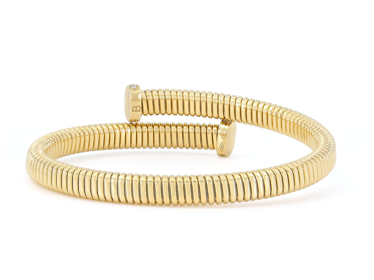 18K yellow gold tubogas bypass bracelet with nail terminals